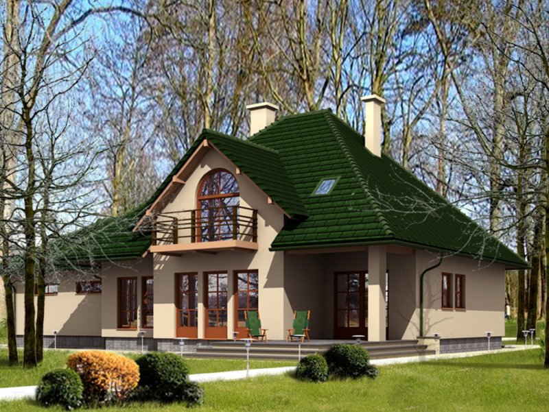 Красивый дом с зеленой крышей