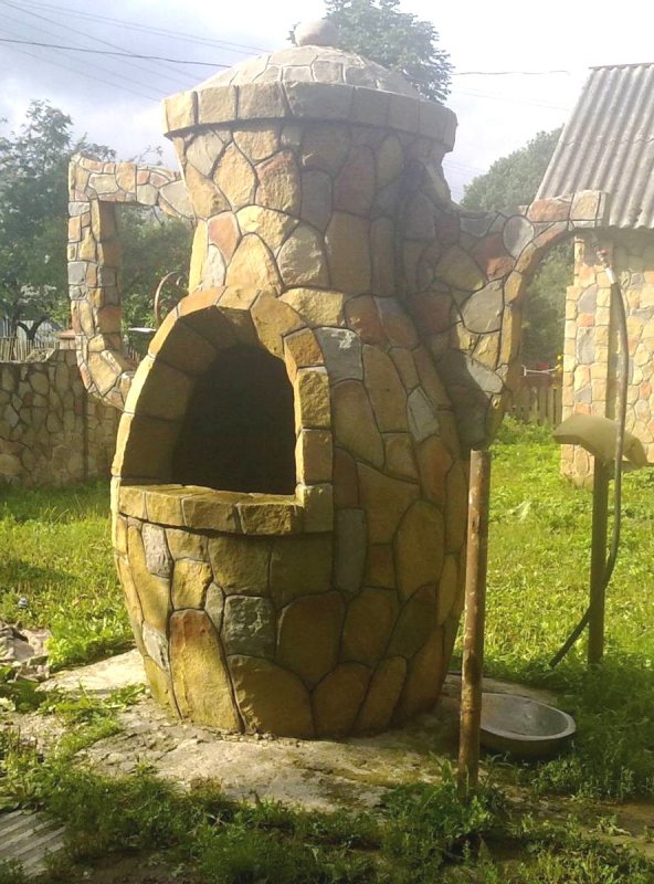 Клумба из колодезного кольца