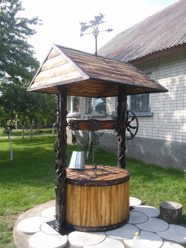 Отделка бетонного кольца колодца