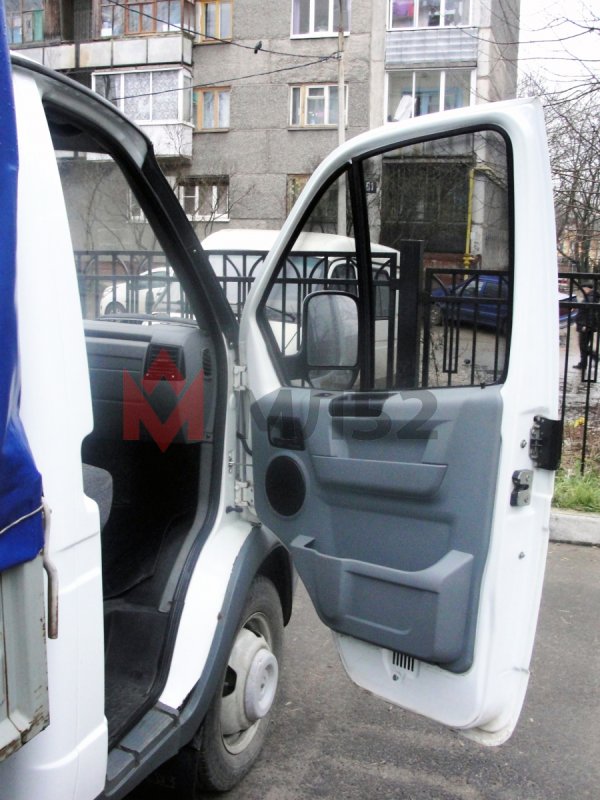 Обшивка двери Газель 3302