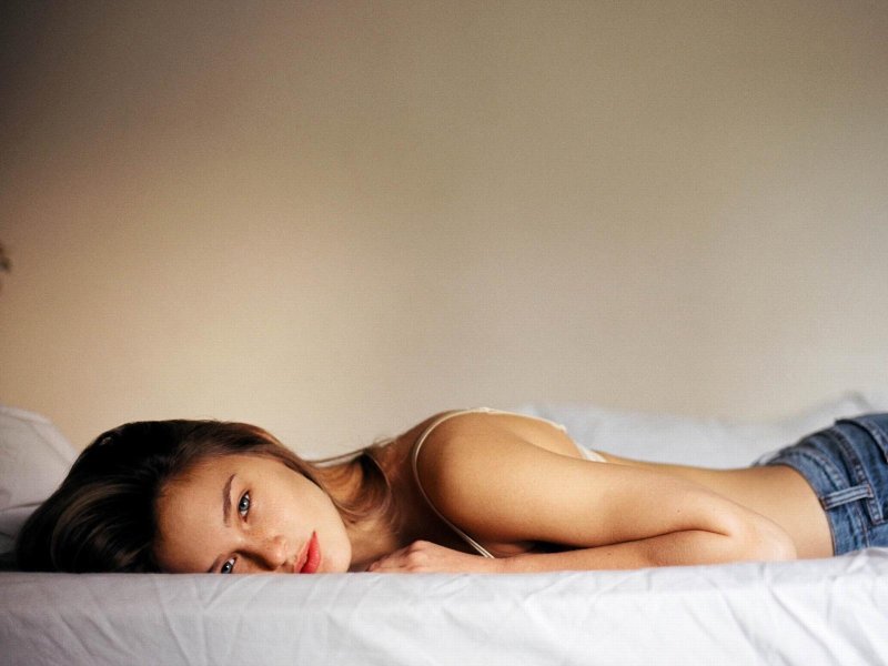 Girl on Top of the Bed