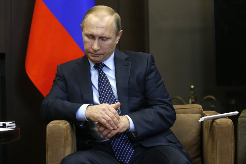 Путин в кресле